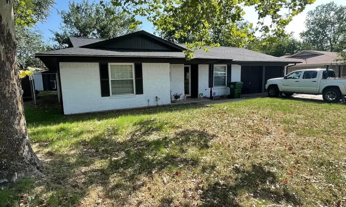 Professional roofing crew working on a residential roof in Hanover